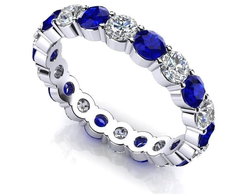 ROUND DIAMONDS & GEMS SHARED IN PRONGS